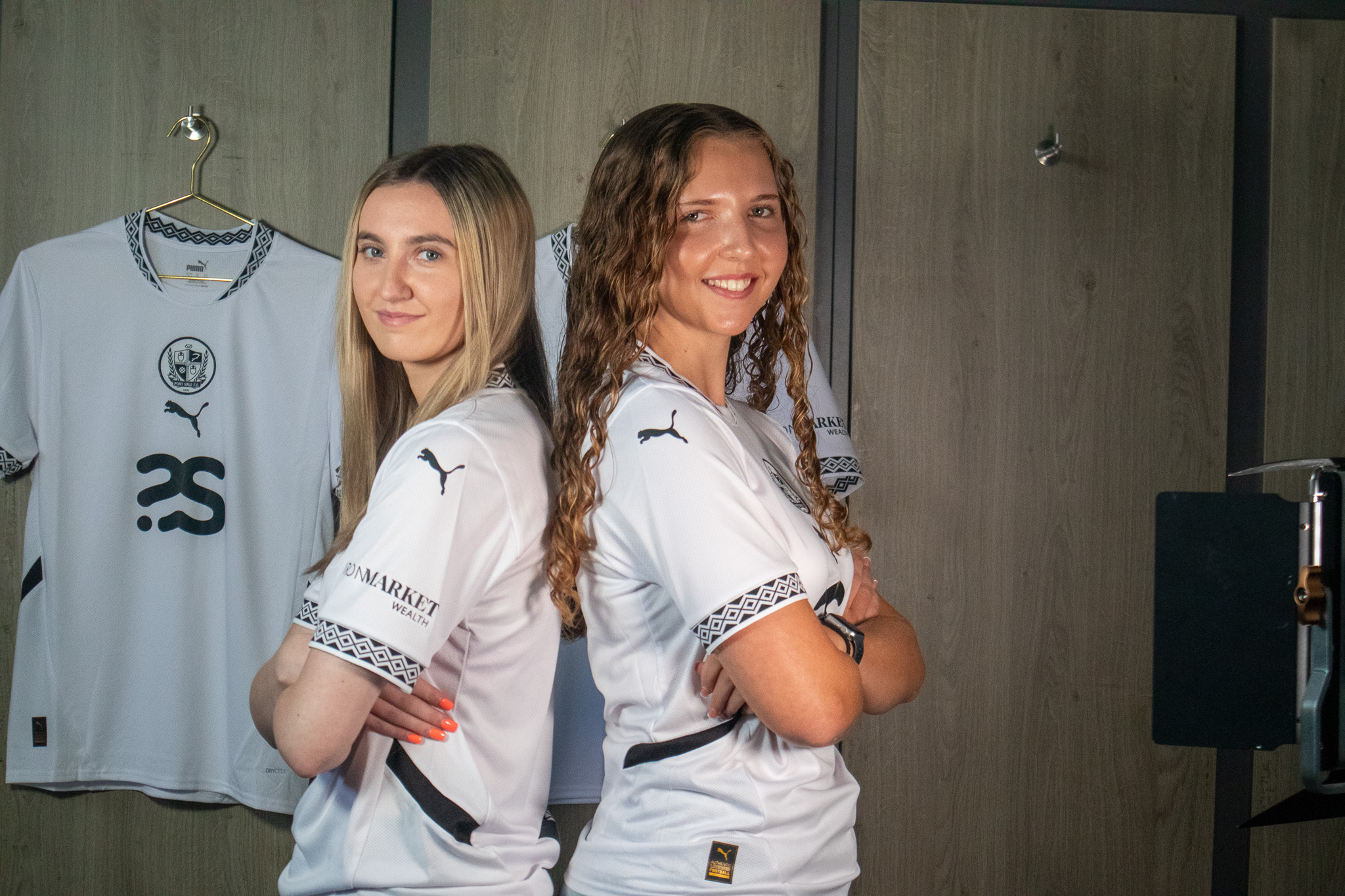 Lilly Jackson and Dani Ebsworth standing back to back in the new Port Vale FC Home Kit